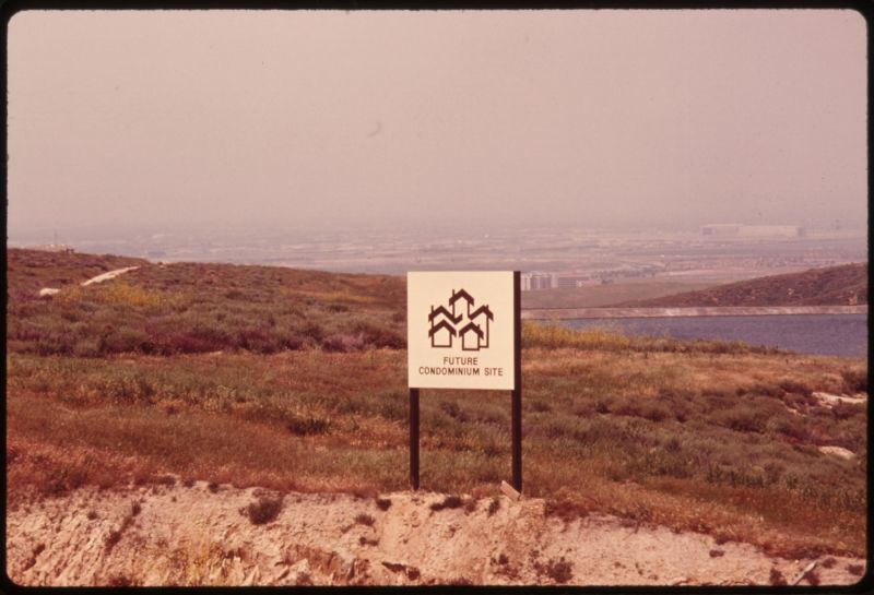 Sign on a bluff signals the site of a future condominium at Upper Newport Bay in Orange County, May 1975