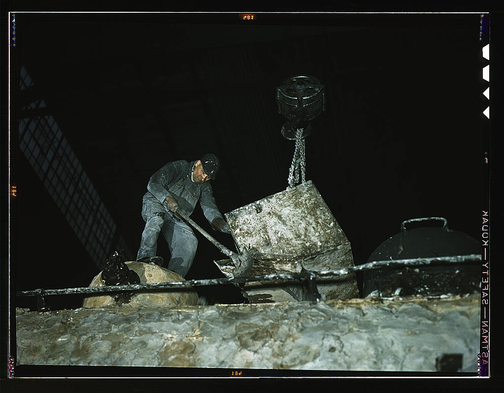 Spreading asbestos mixture on boiler of a locomotive at the C & NW RR 40th Street locomotive shops  (LOC)