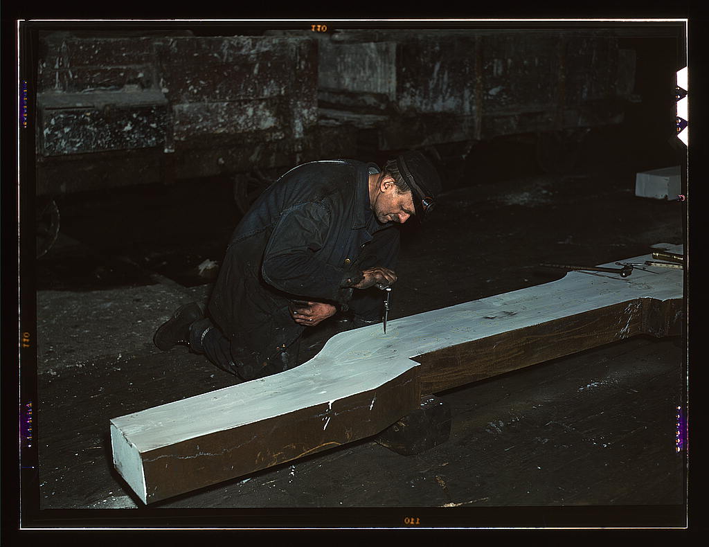 Section of a locomotive frame, which will be welded to replace a broken locomotive frame, Chicago, Ill. Workman is indicating what place must be cut. At the 40th Street shop of C&NWRR  (LOC)