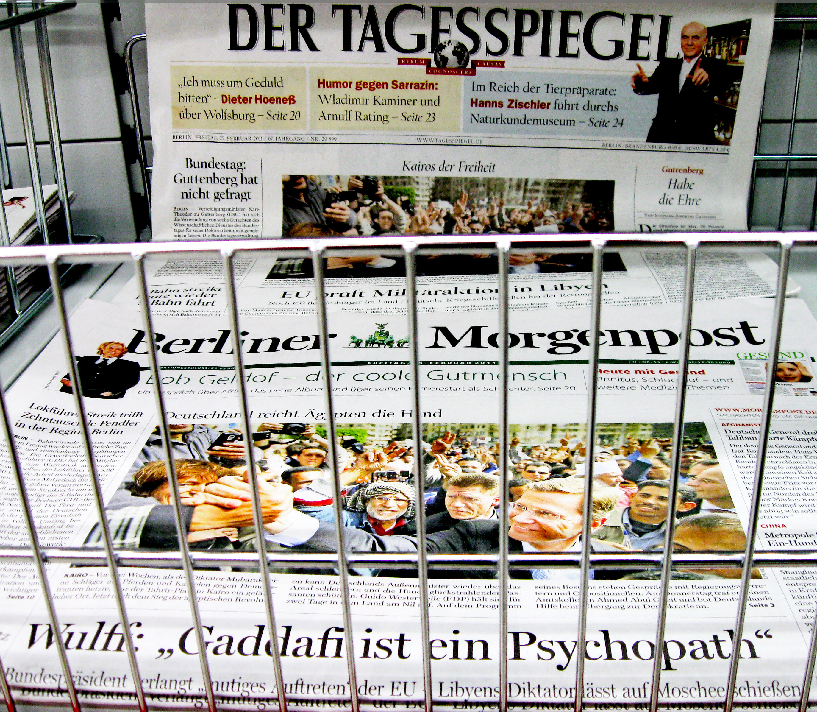 german dailies about Muammar Gaddafi - behind newspaper box bars (23rd February 2011)