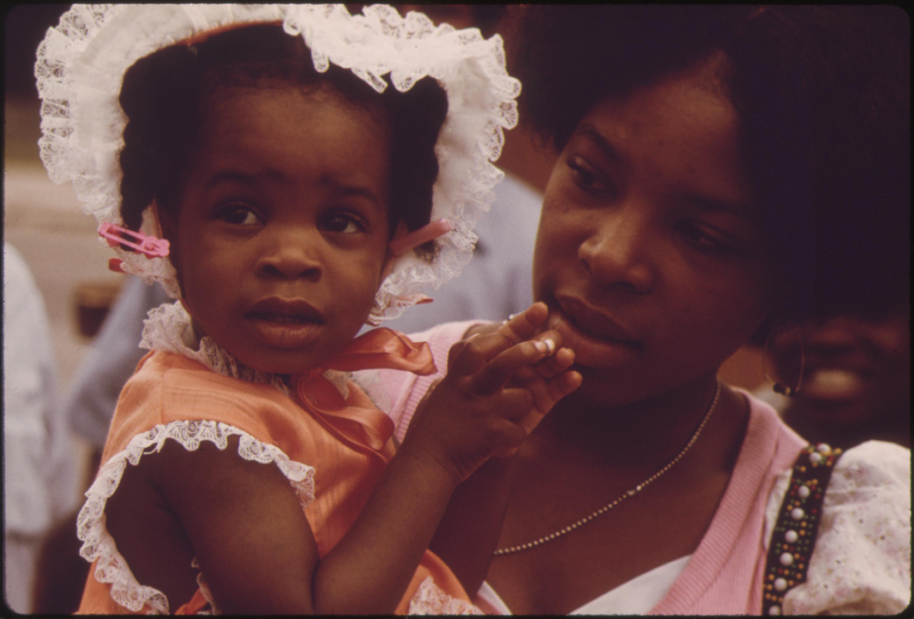 A Black Mother And Child, Part Of The 1.2 Million People Of Their Race Who Make Up Over One Third Of Chicago's Population, 08/1973