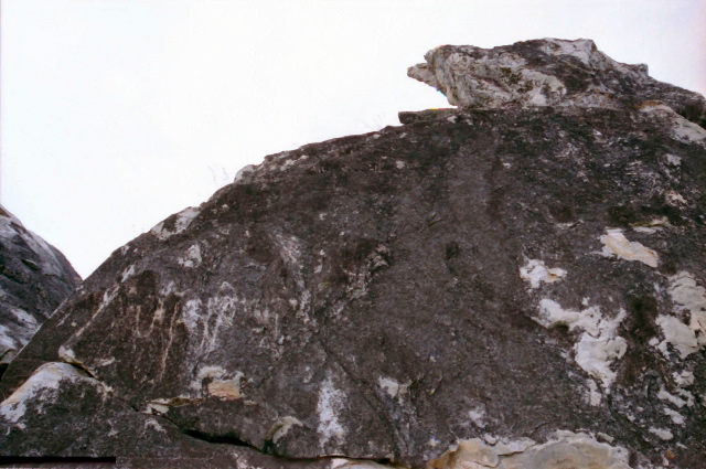 Vulture Peak (Grdhrakuta) in Rajgir where the Buddha inspired Avalokiteshvara to give The Heart Sutra - the Prajna Paramita Hridaya Sutram  requested by Sariputra, rock that looks like a vulture; upper right, facing left. India